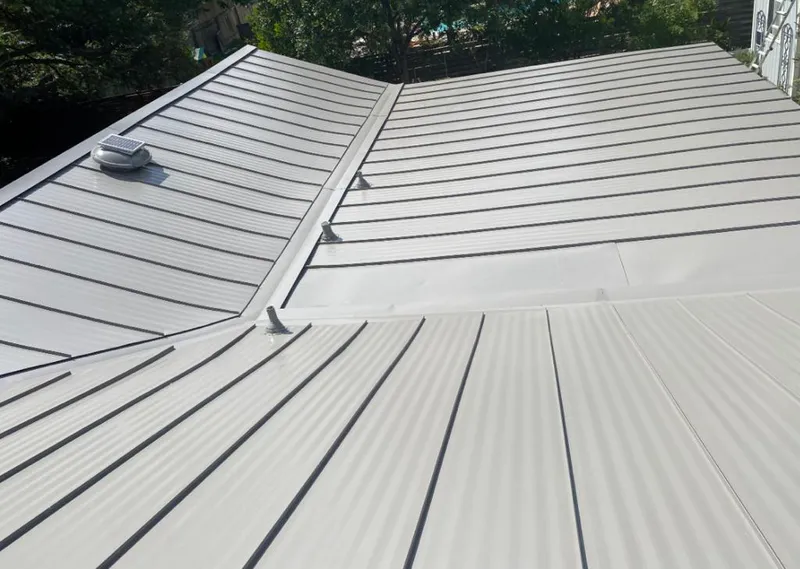 Solar attic fan installed on a metal roof for Roof Ventilation in Verona